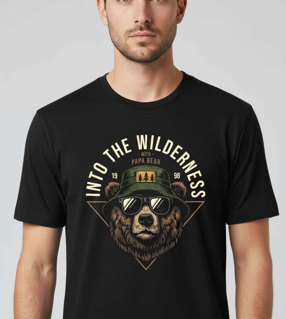 Person wearing a black t-shirt with a bear graphic and text 'Into the Wilderness' on a plain background