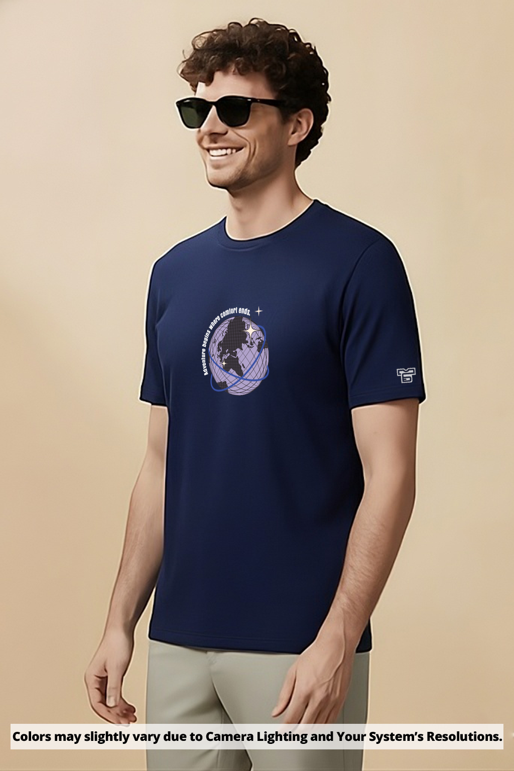 Man wearing a Navy blue t-shirt with a graphic design on a beige background