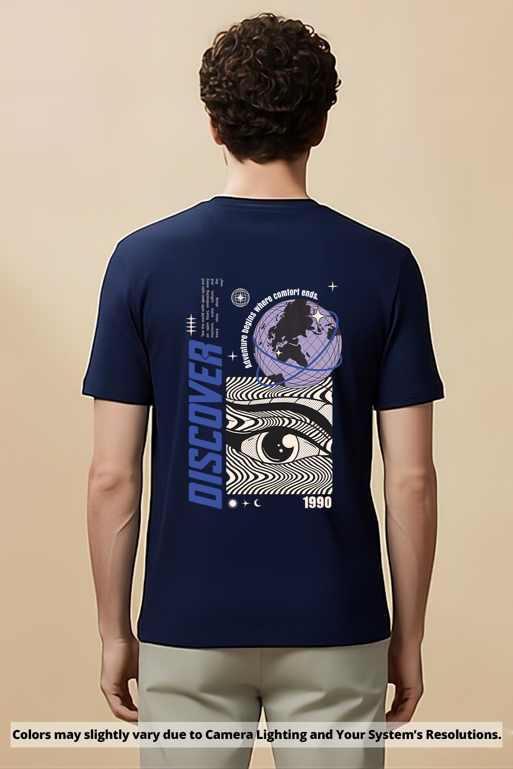 Person wearing a Navy blue t-shirt with a graphic design on the back, standing against a beige background.